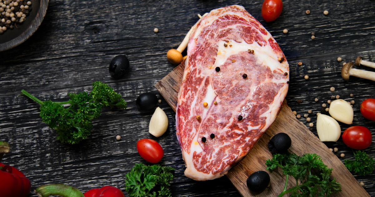 steak on black countertop